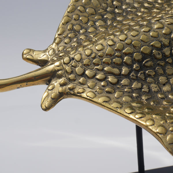 a close up of a metal object on a stand