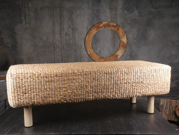 a bench made of wood and woven material